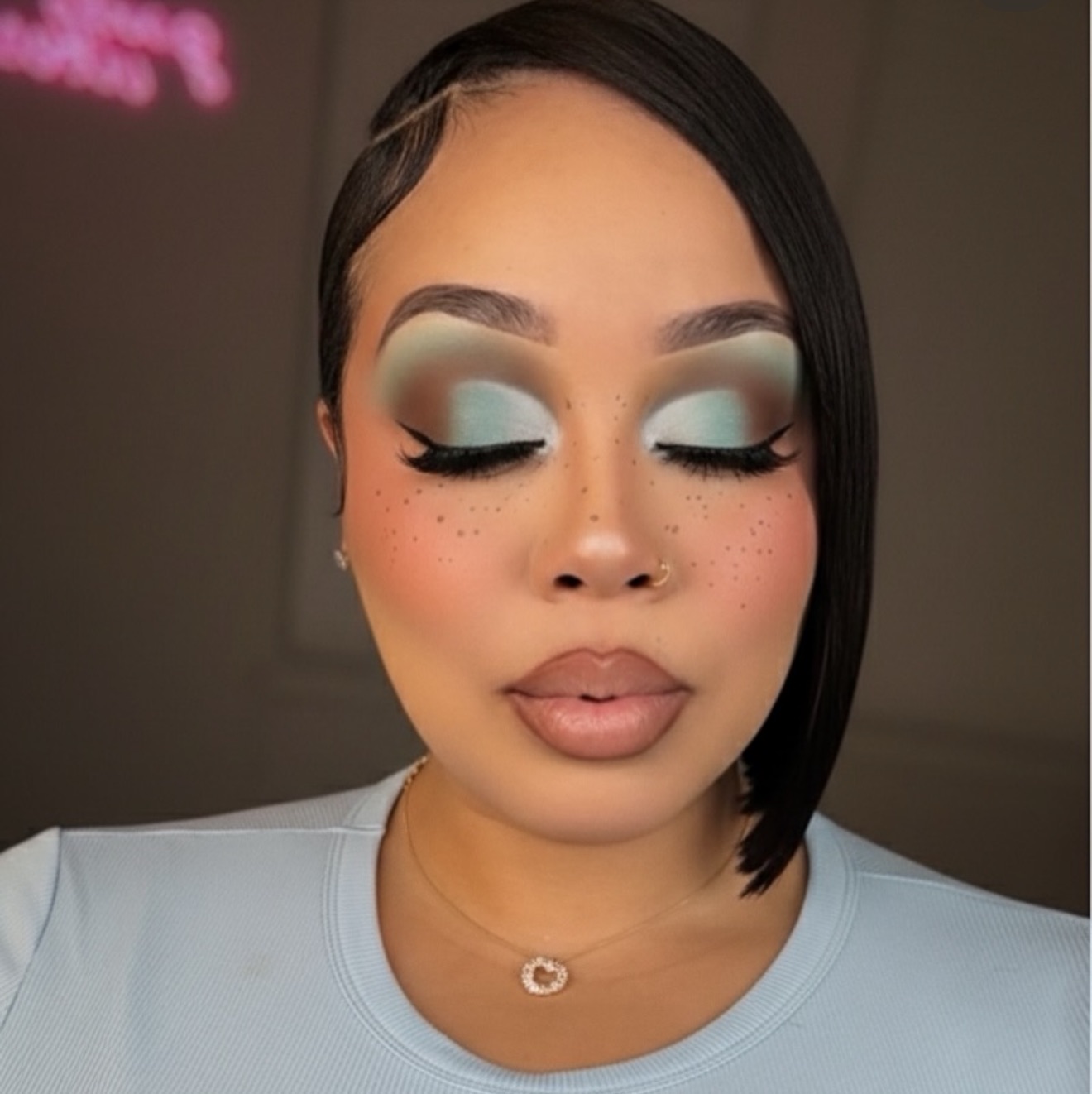 Editorial close-up with mint shadow and faux freckles